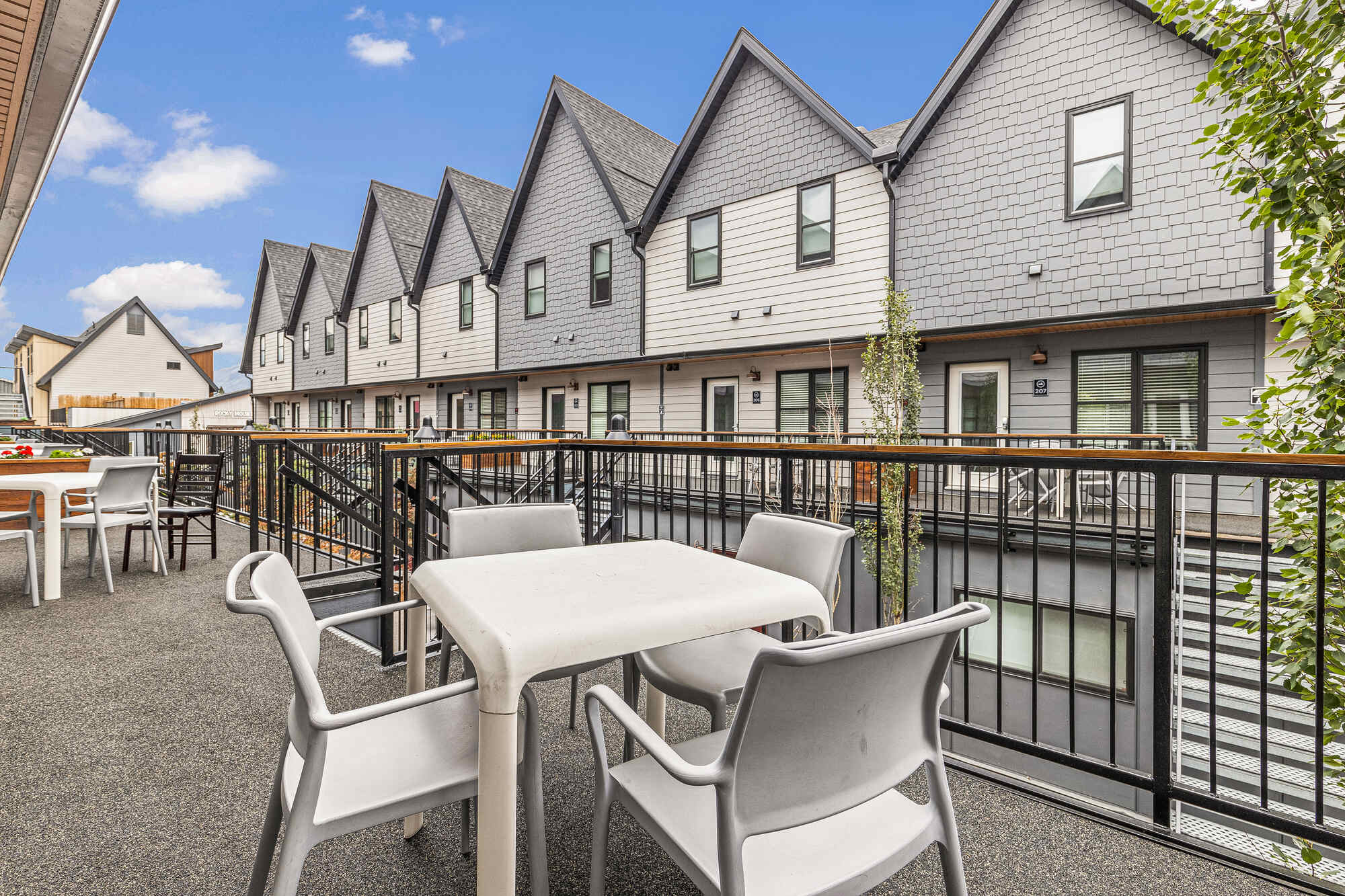 Balcony of a two-bedroom suite at Basecamp Resorts Canmore with outdoor seating