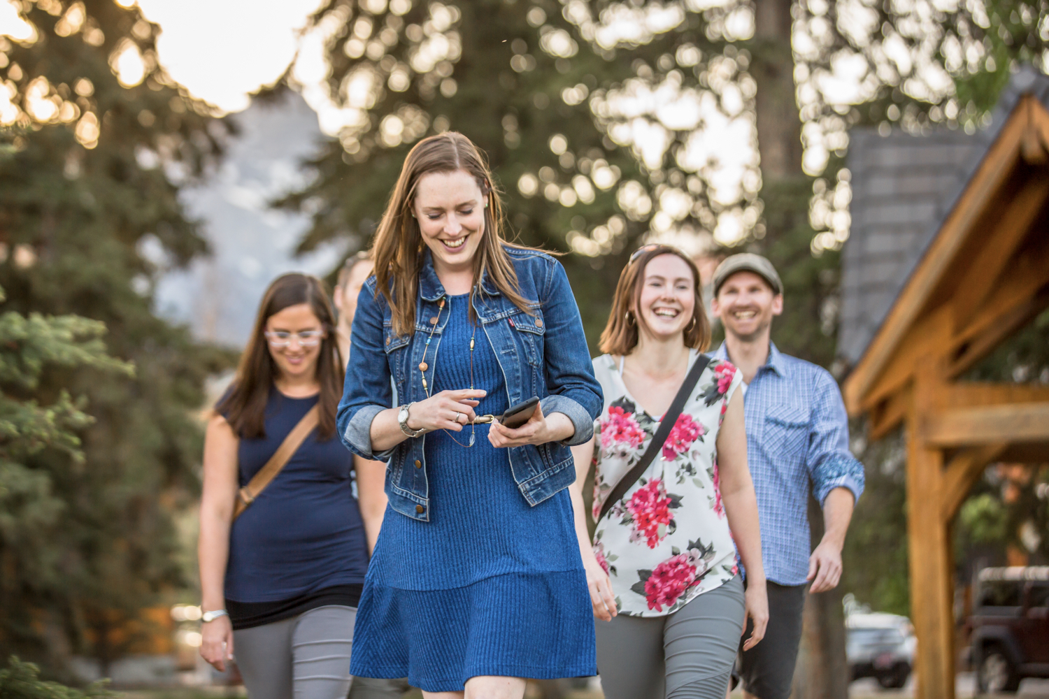 Cluesolvers group walking outdoors, smiling in the sunshine