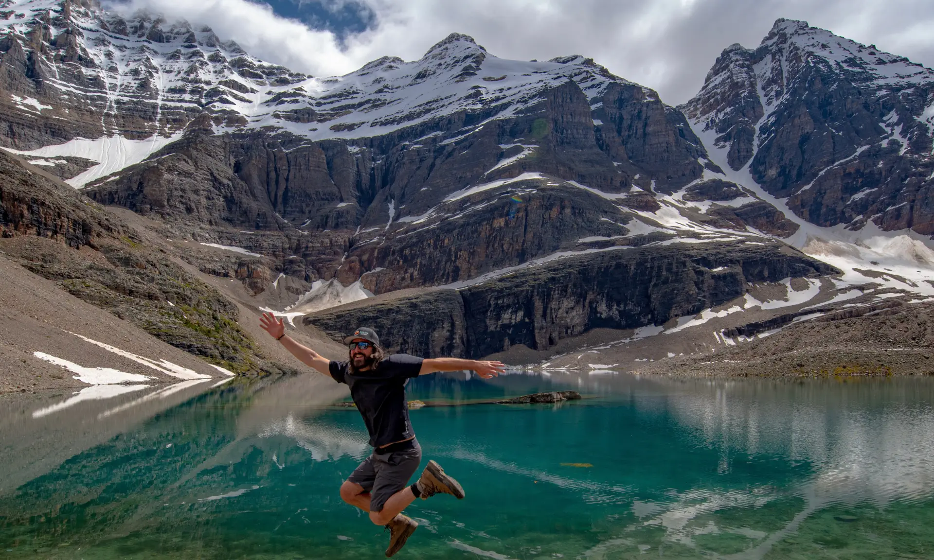 Man jumping in front of Moraine Lake, Banff National Park, Canada