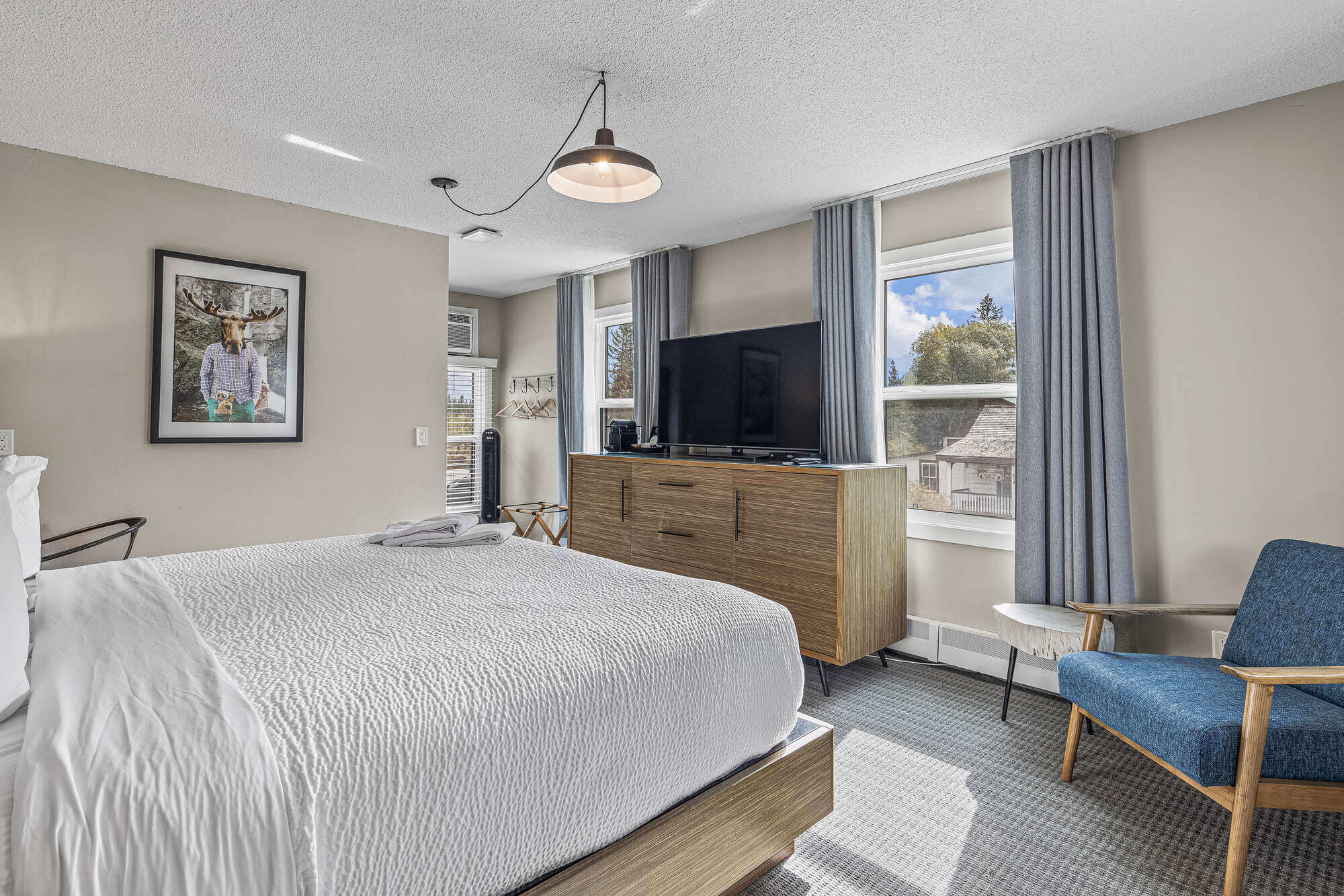 Basecamp Lamphouse Canmore King room with king bed, TV, and mountain views