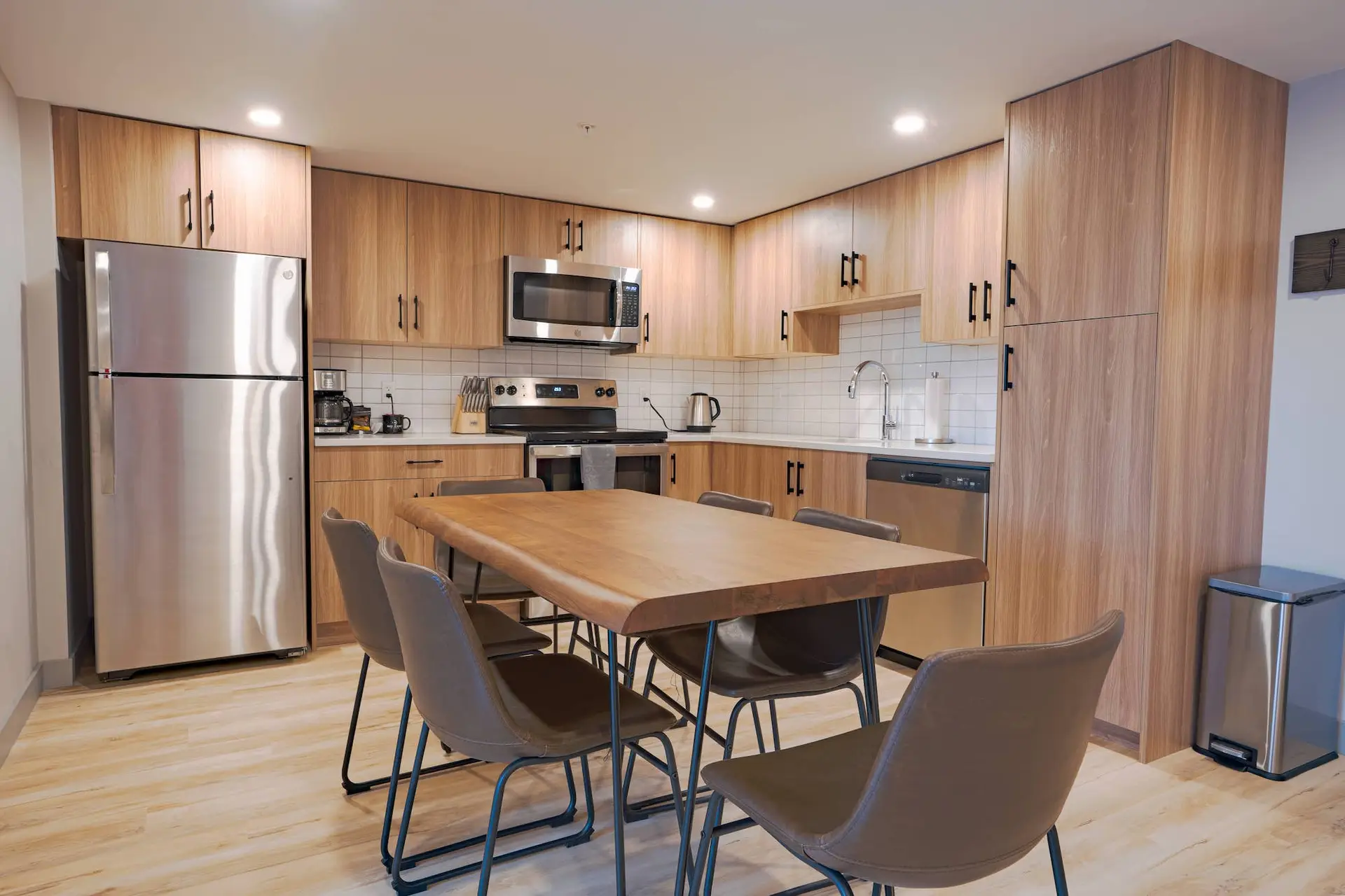Modern kitchen and dining area in Basecamp Suites Banff Superior Two King Suite