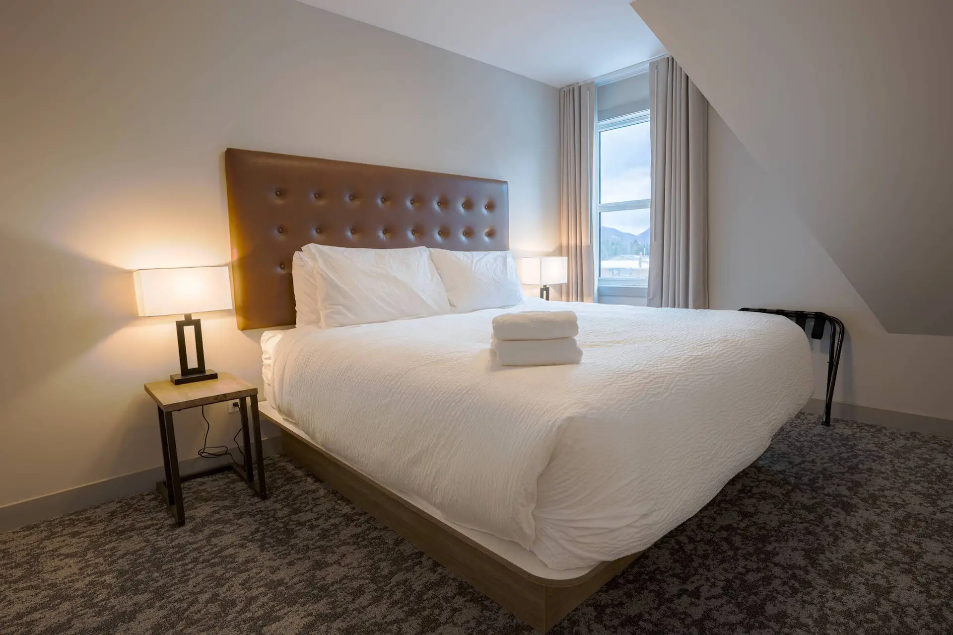 Basecamp Suites Banff Superior Two King Suite bedroom with two king beds and mountain view
