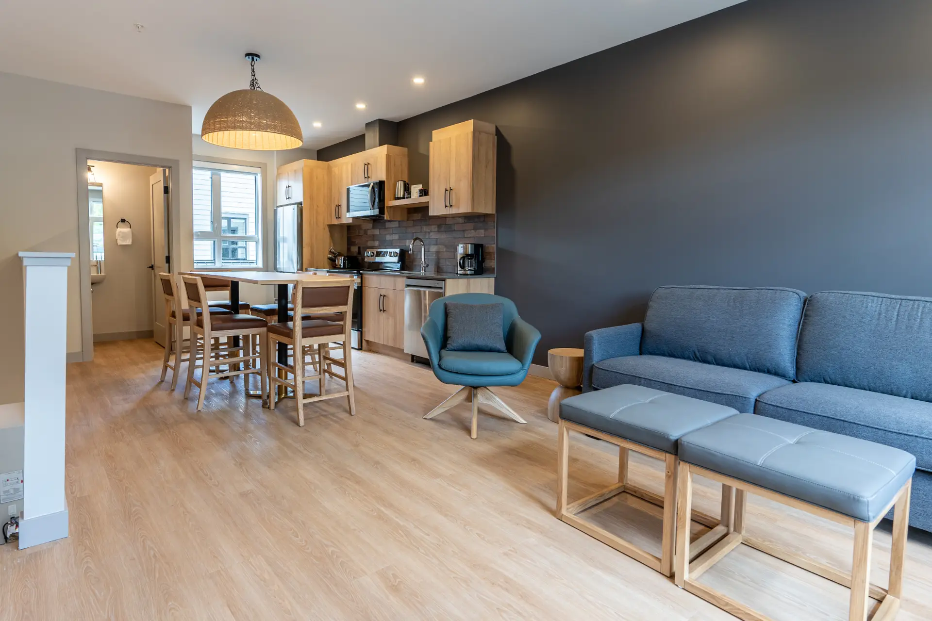 Basecamp Suites Revelstoke two-bedroom suite living area and kitchen