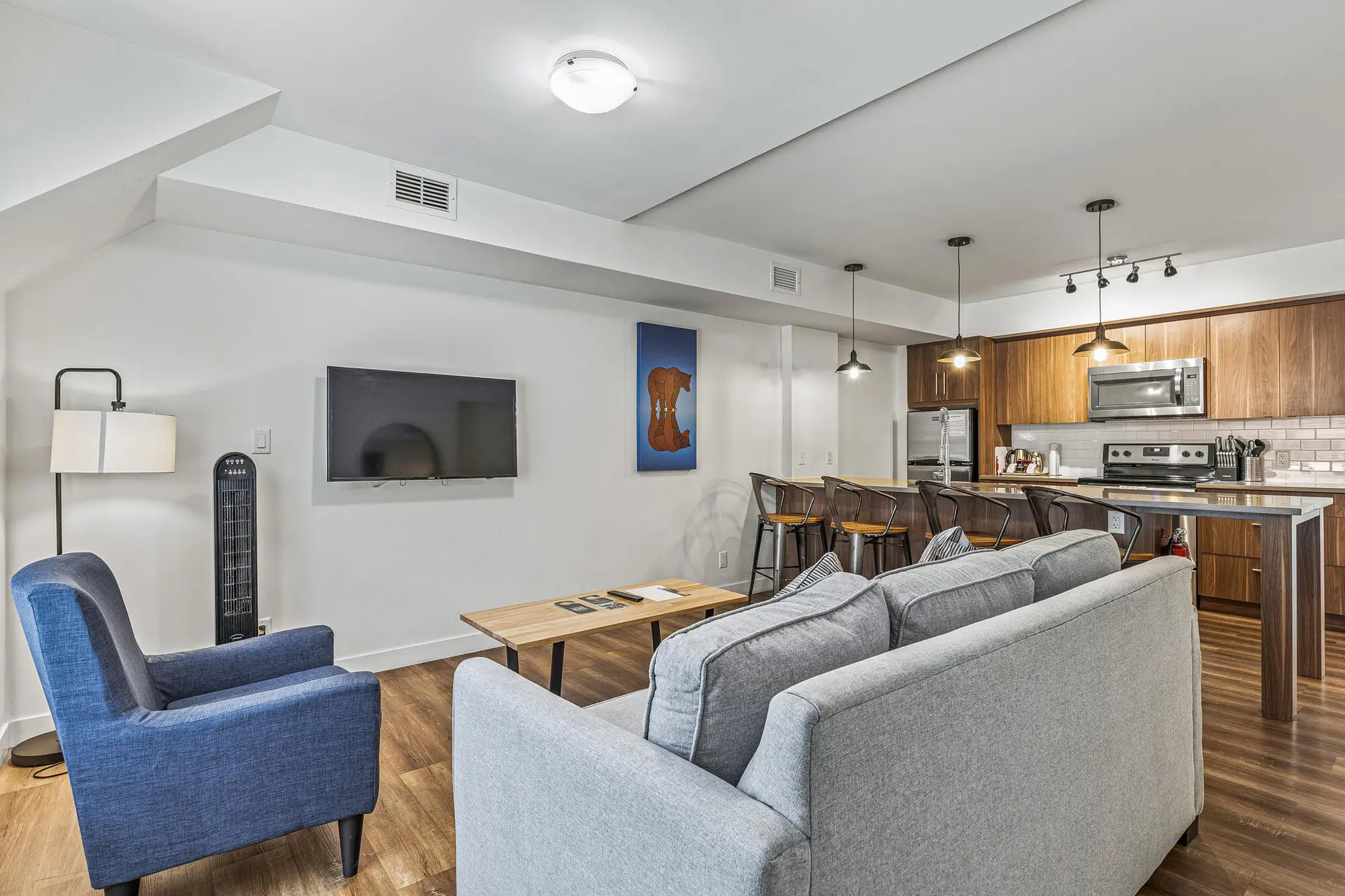 Basecamp Resorts Canmore one bedroom suite living area with kitchen.