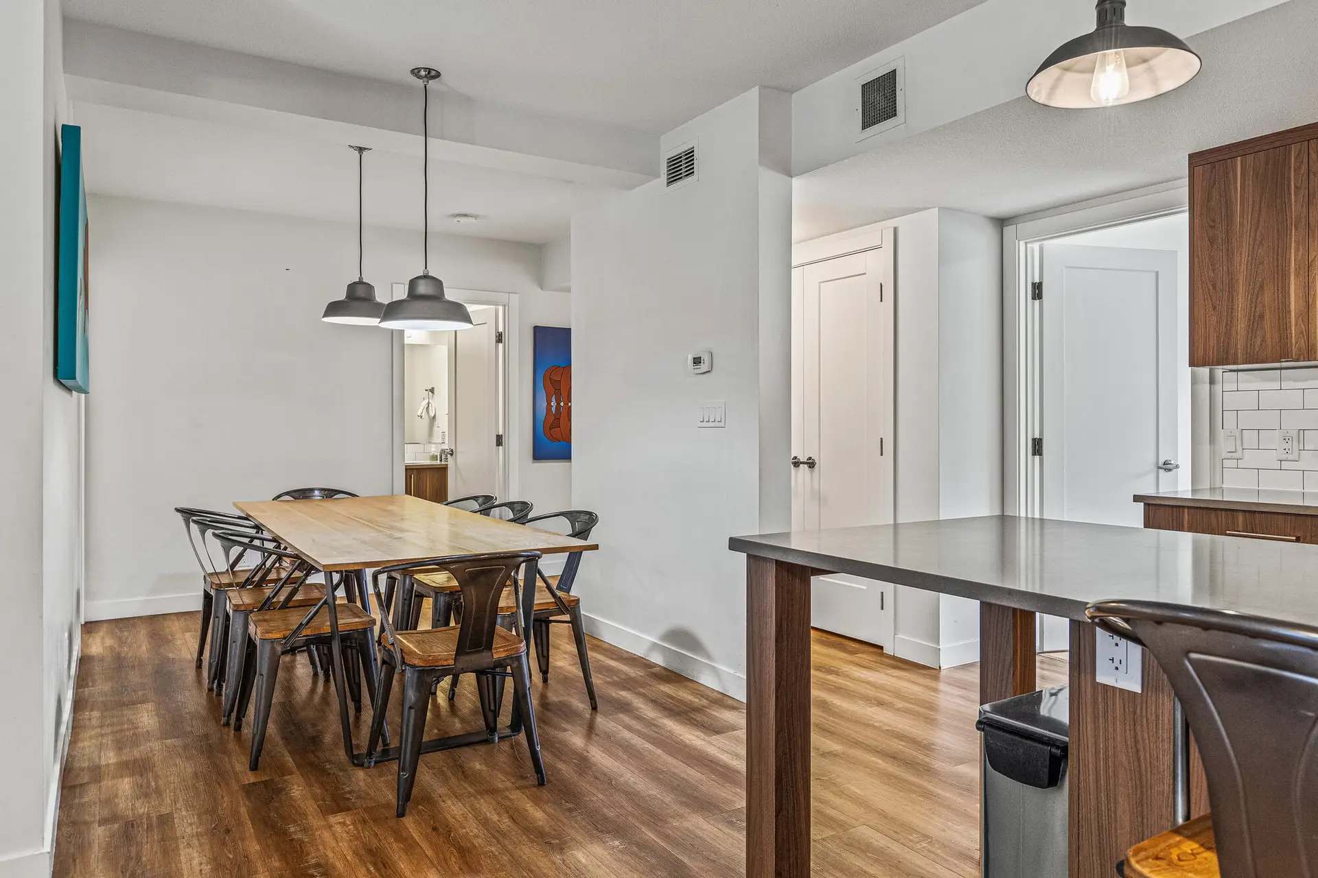 Basecamp Resorts Canmore three-bedroom suite dining area with table and chairs.