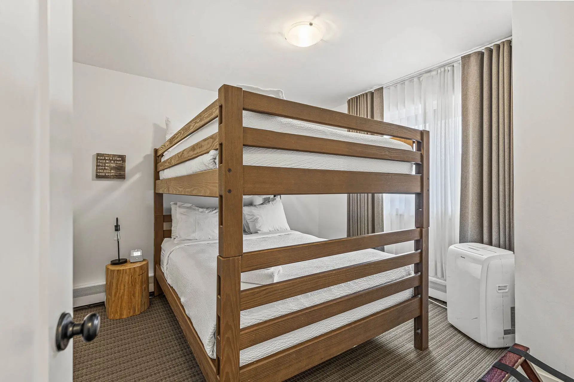 Bunk beds in a bedroom at Basecamp Lamphouse Canmore, Lamphouse Apartment